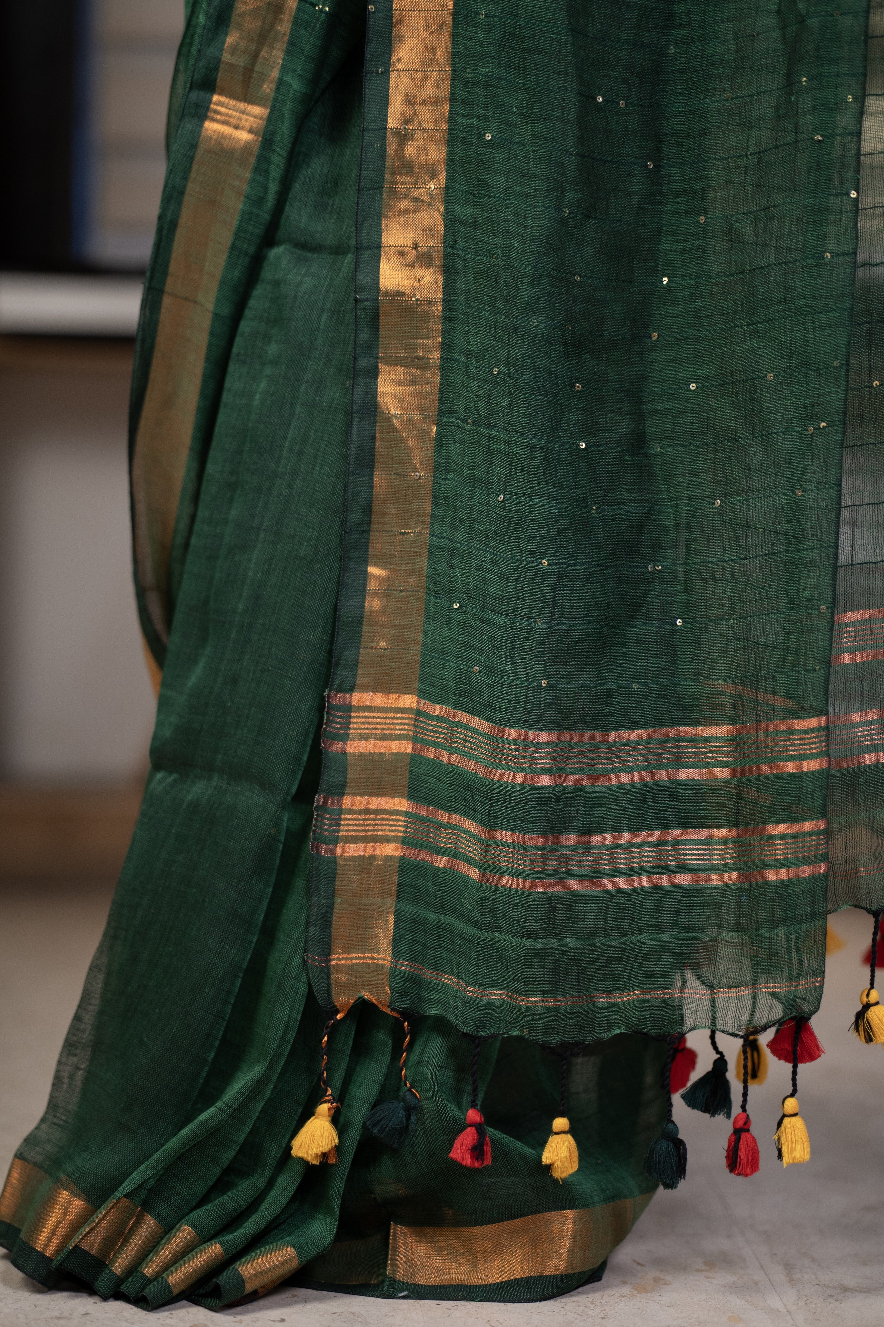 Dark green Sequence Work Linen Saree with golden zari border