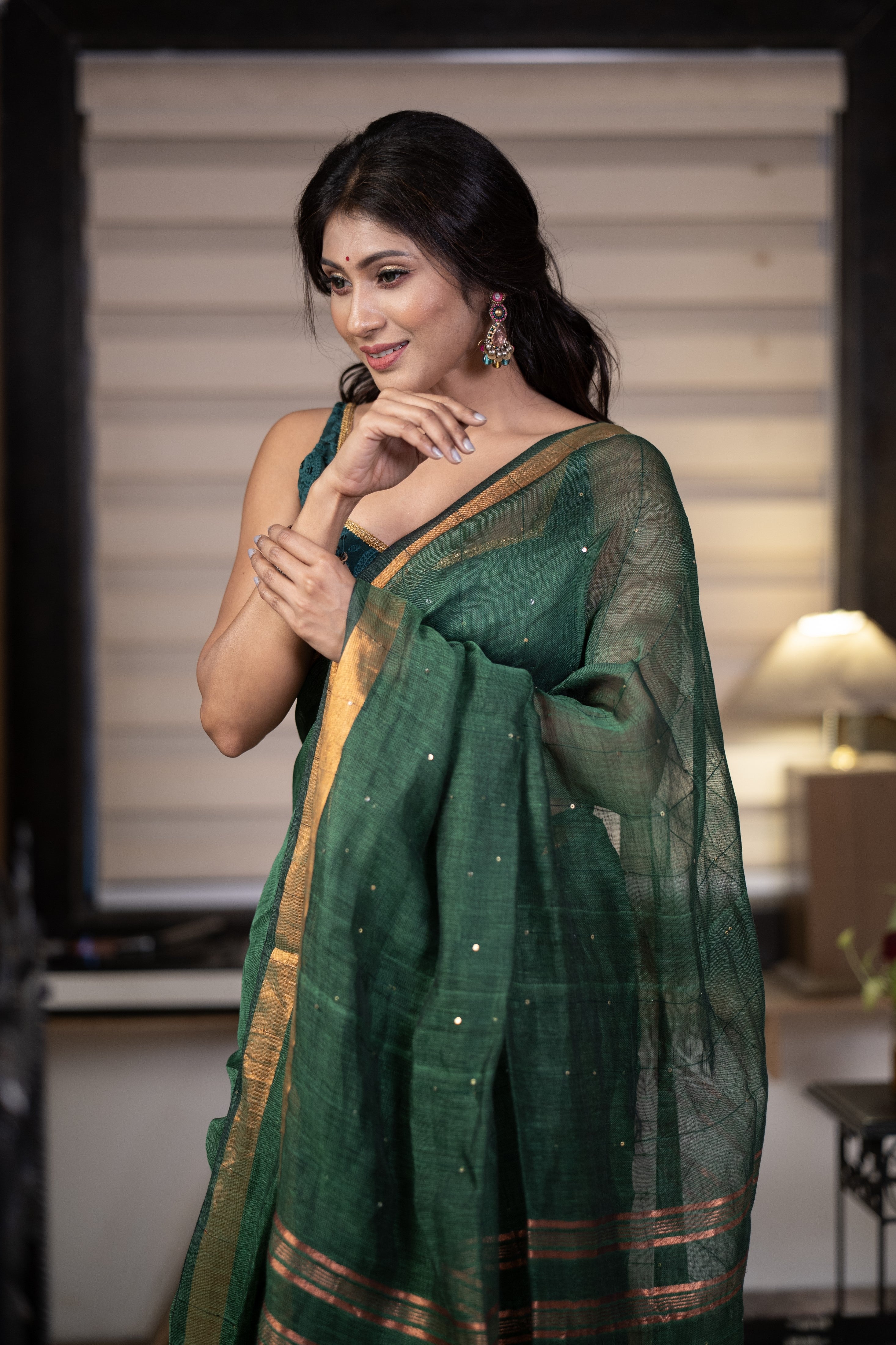 Dark green Sequence Work Linen Saree with golden zari border