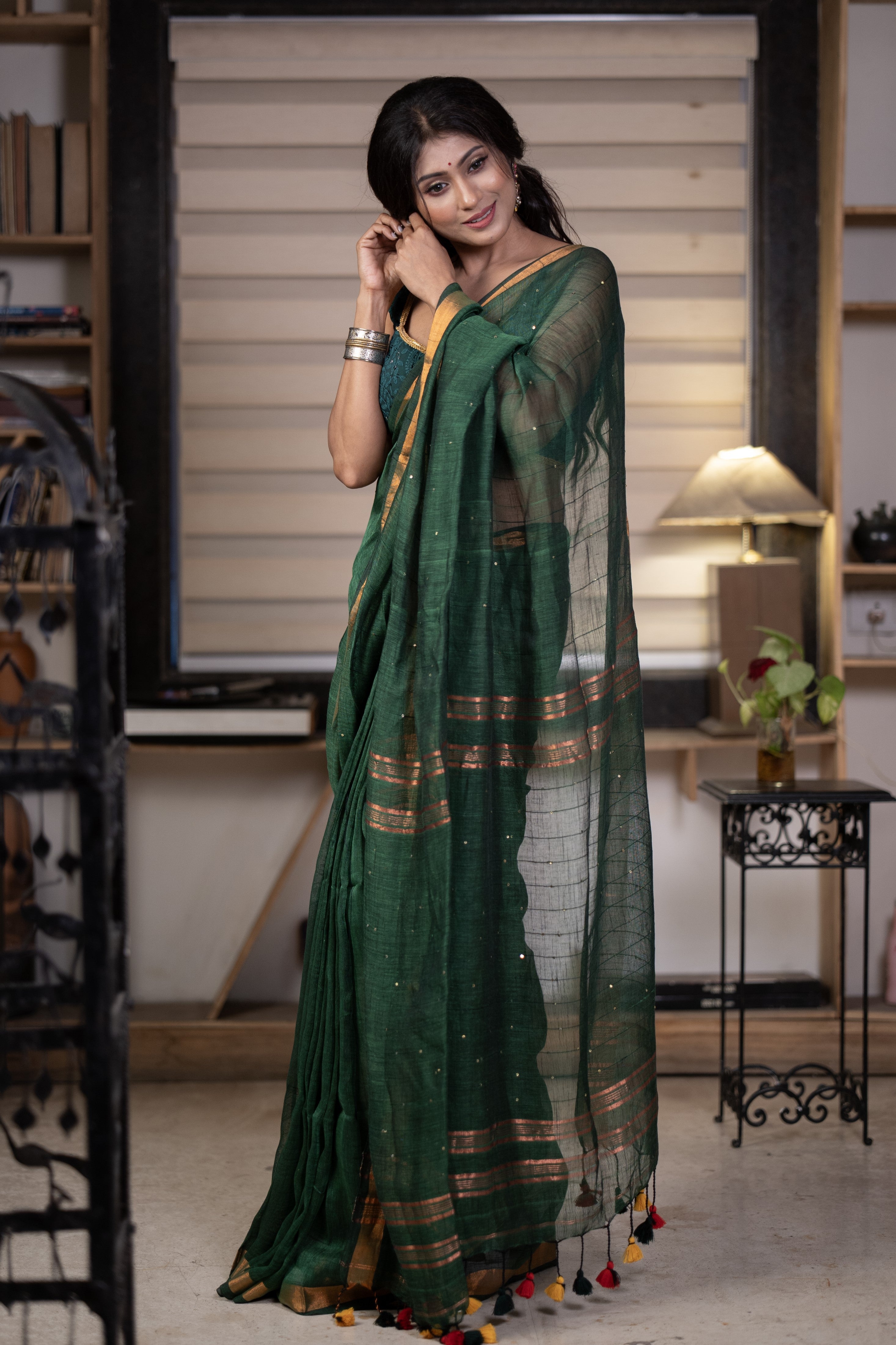 Dark green Sequence Work Linen Saree with golden zari border