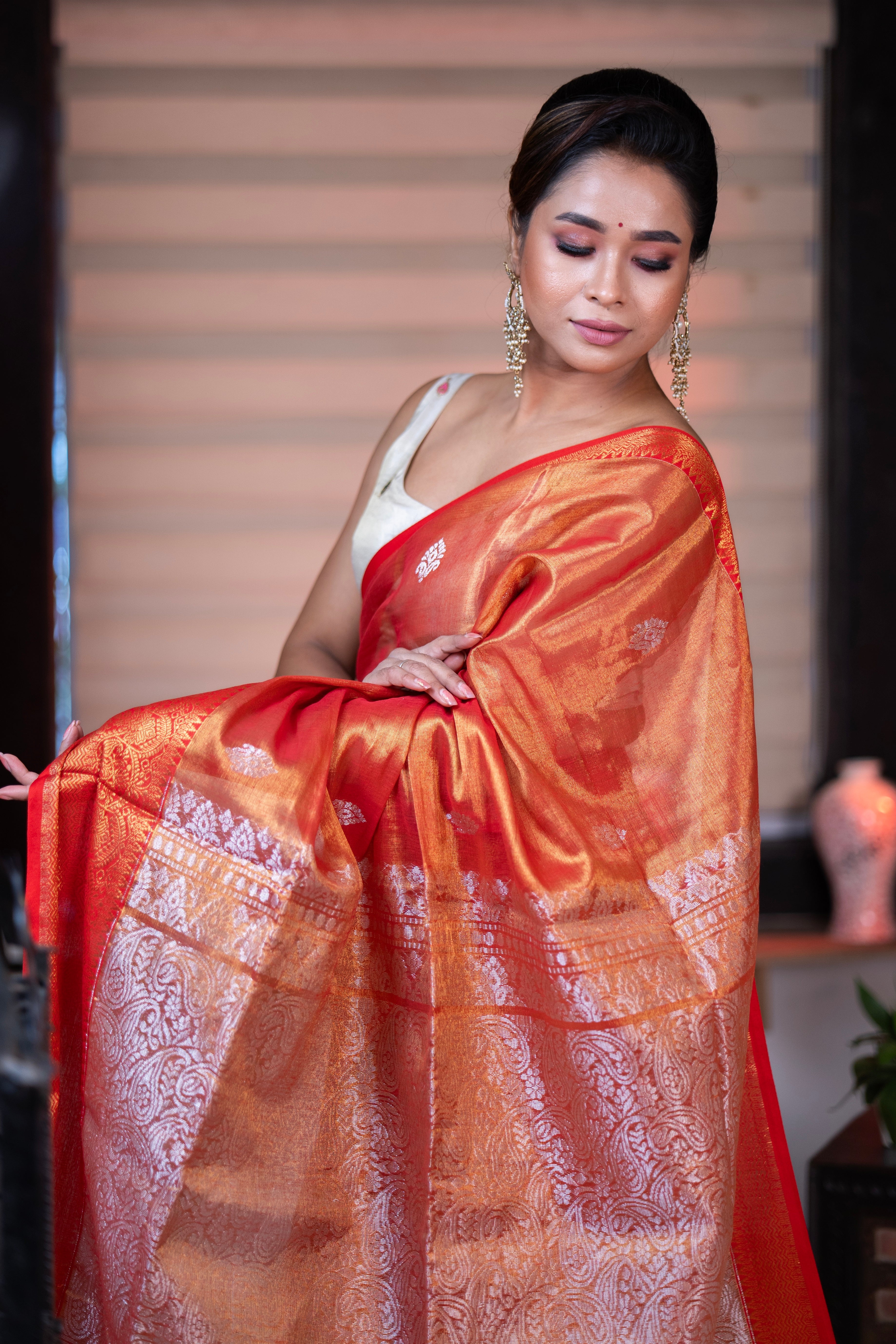 Metallic Orange dual tone Tissue Linen Handwoven Saree