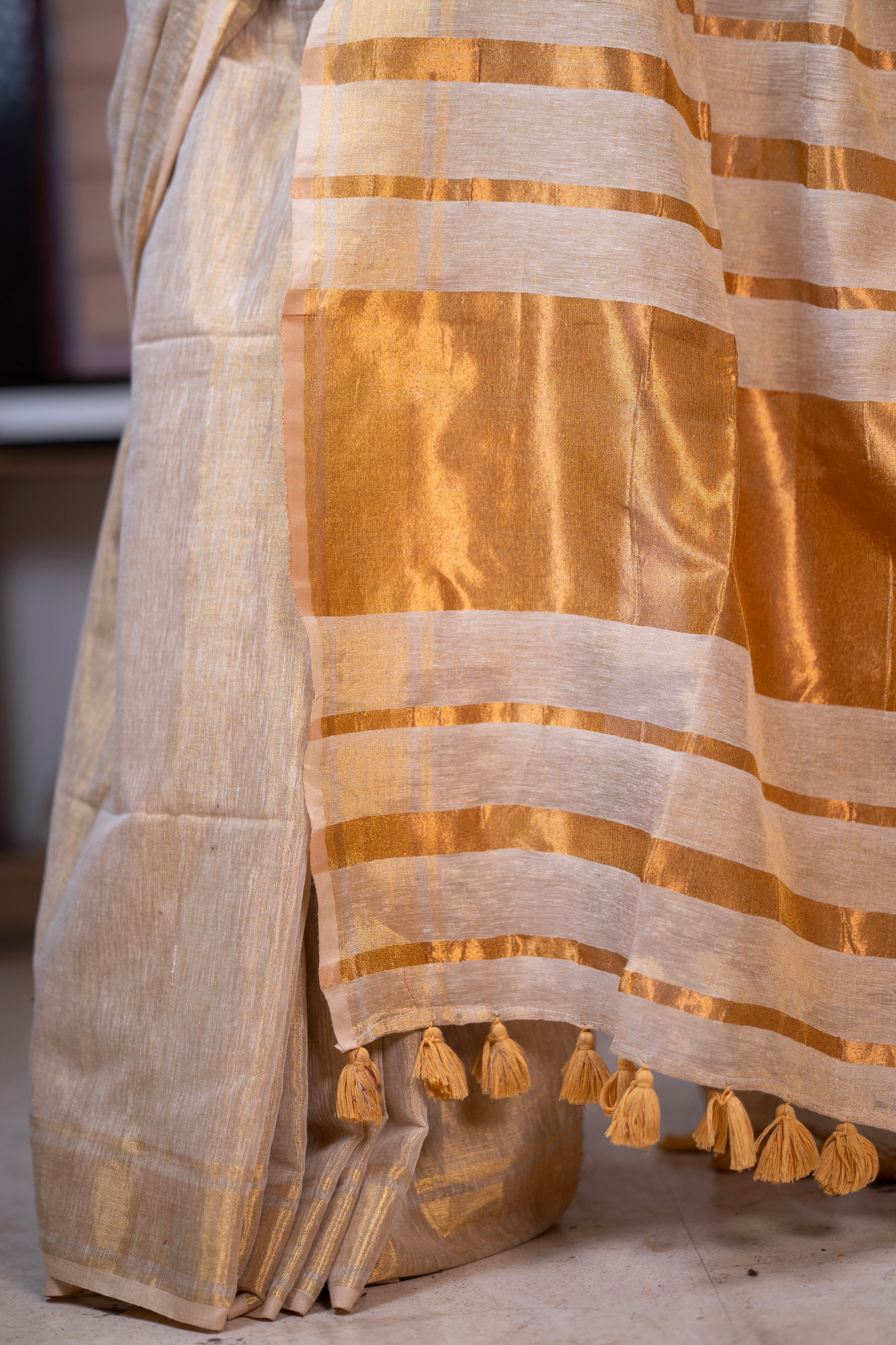Golden dual tone pure tissue linen saree