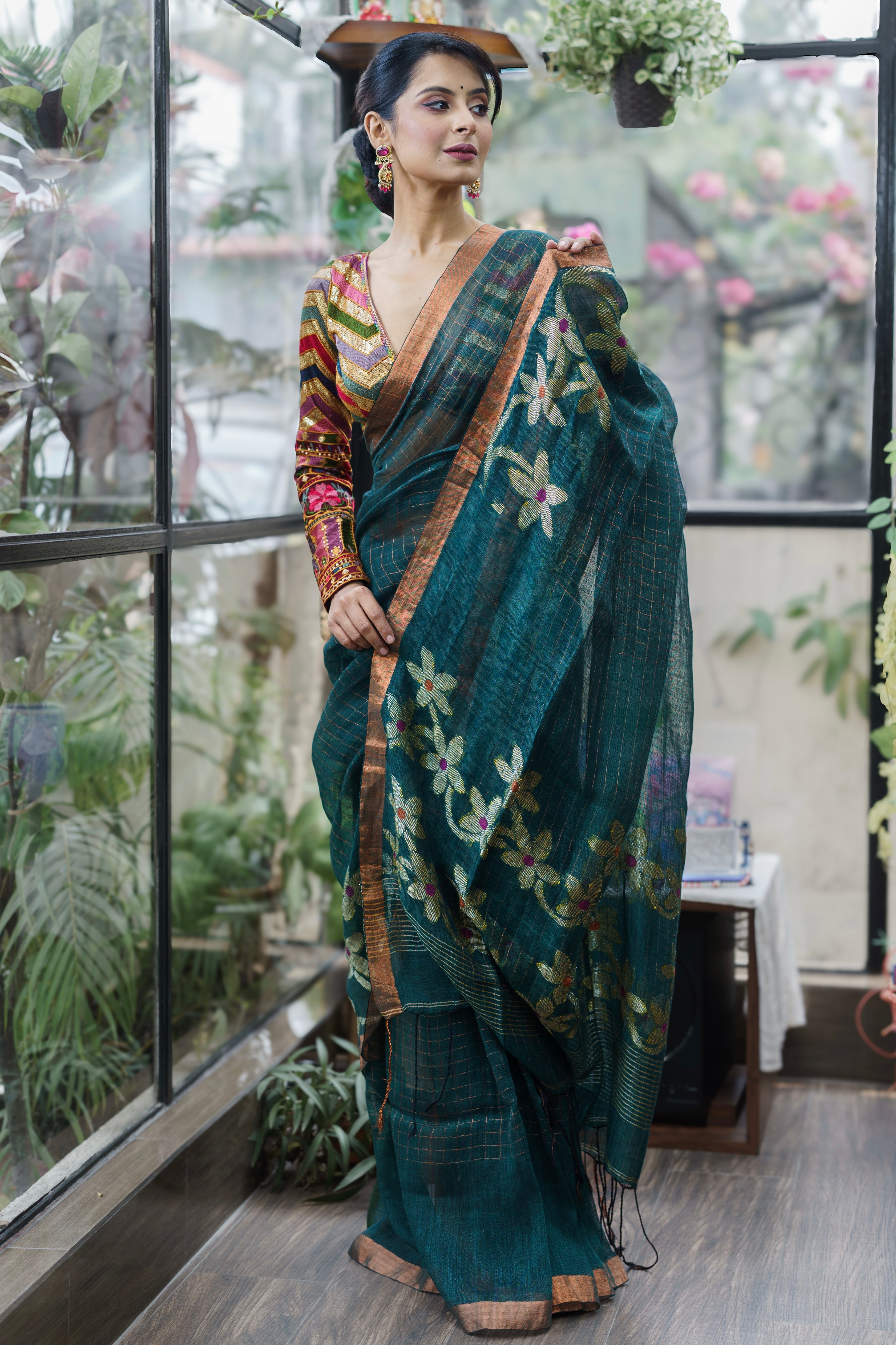 Forest Green Handwoven Linen Saree with Zari Checks & Floral Motifs