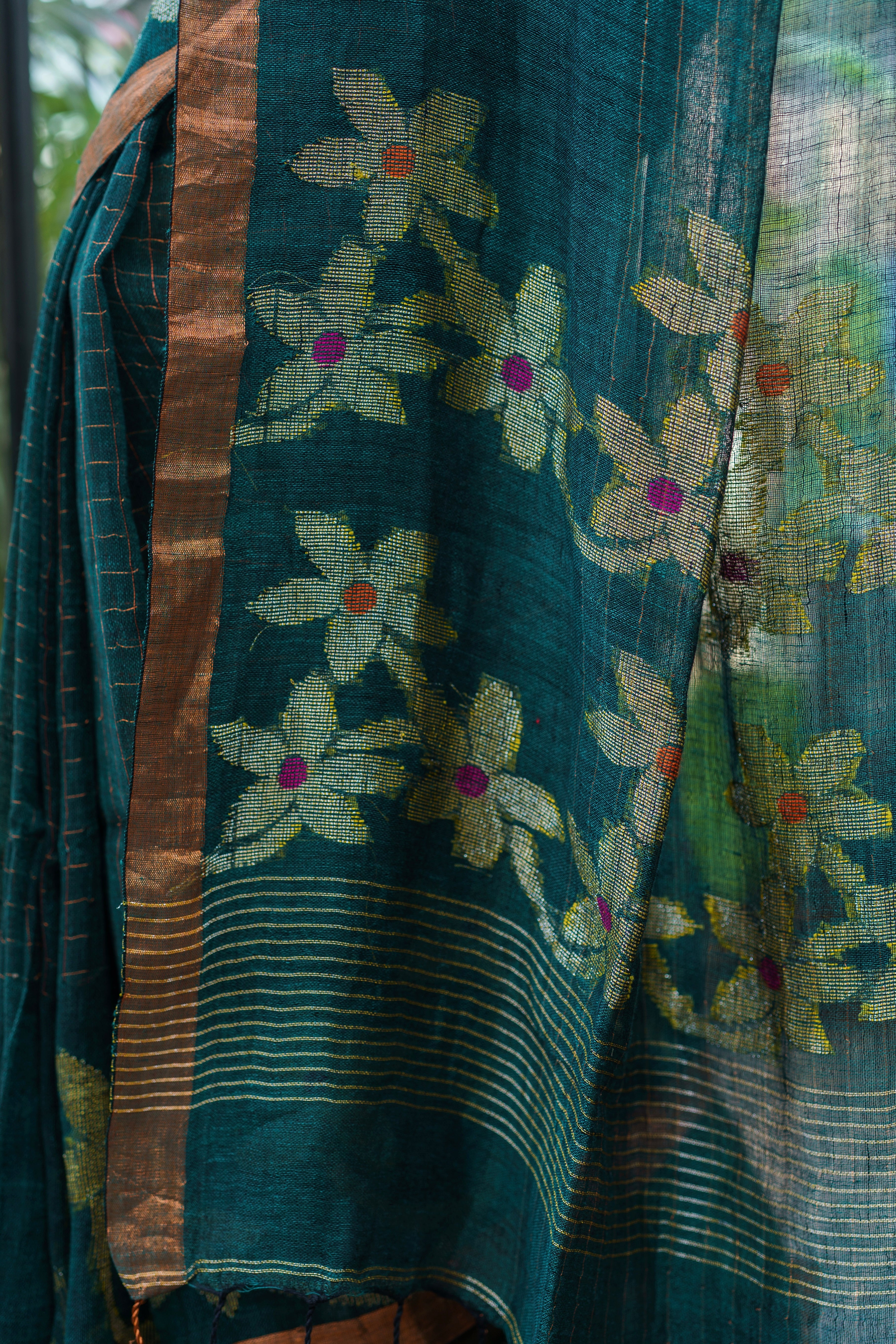 Forest Green Handwoven Linen Saree with Zari Checks & Floral Motifs