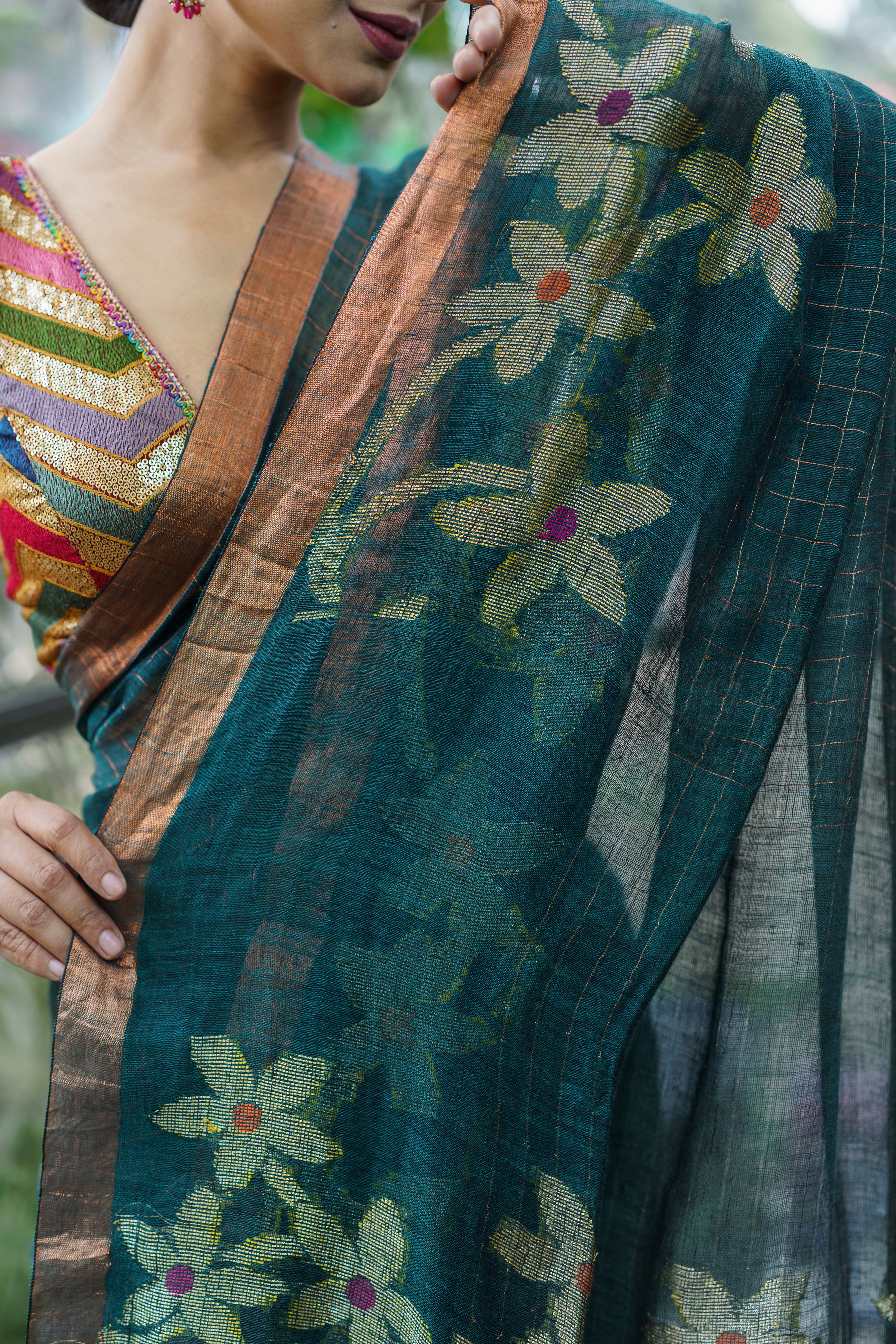 Forest Green Handwoven Linen Saree with Zari Checks & Floral Motifs