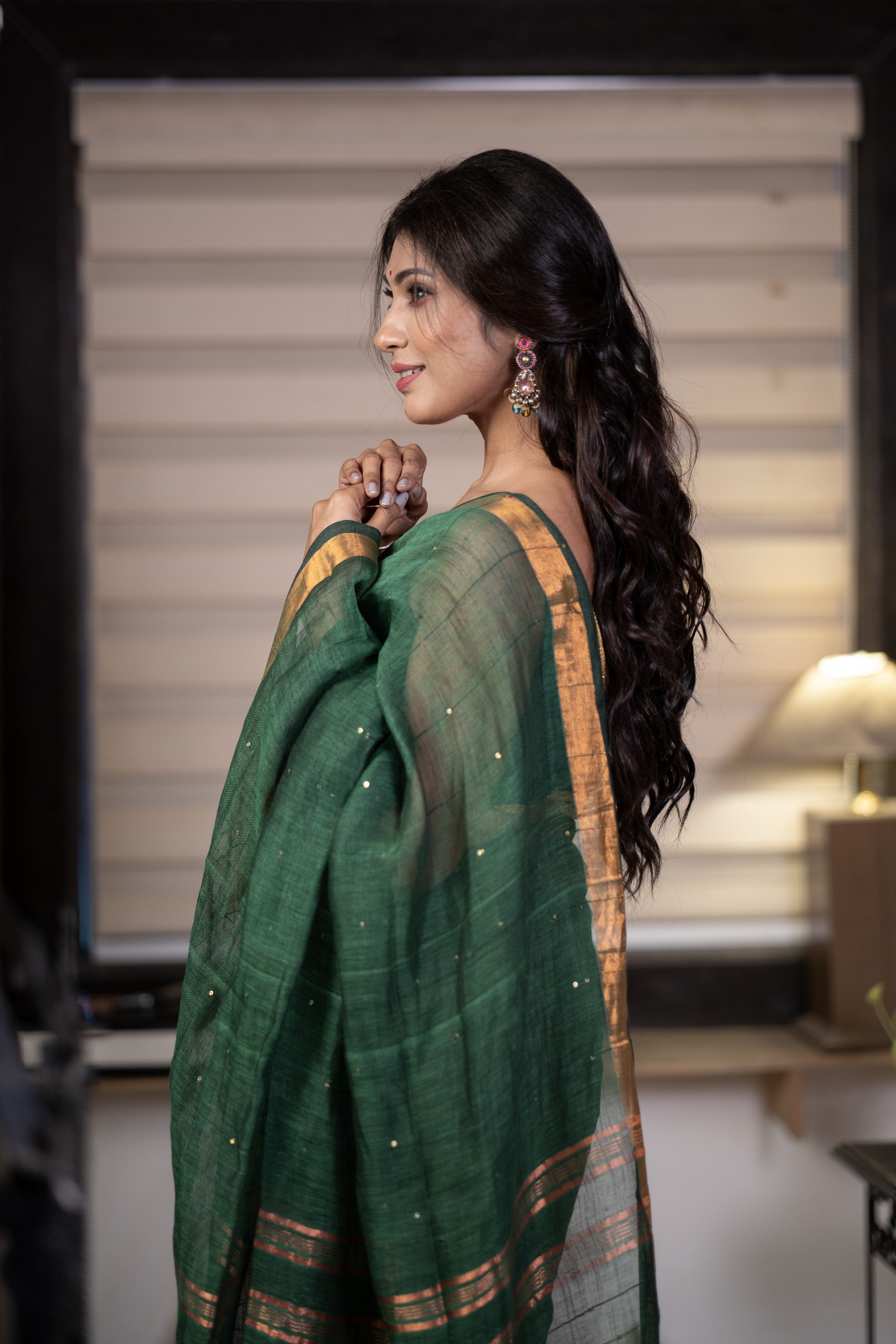 Dark green Sequence Work Linen Saree with golden zari border