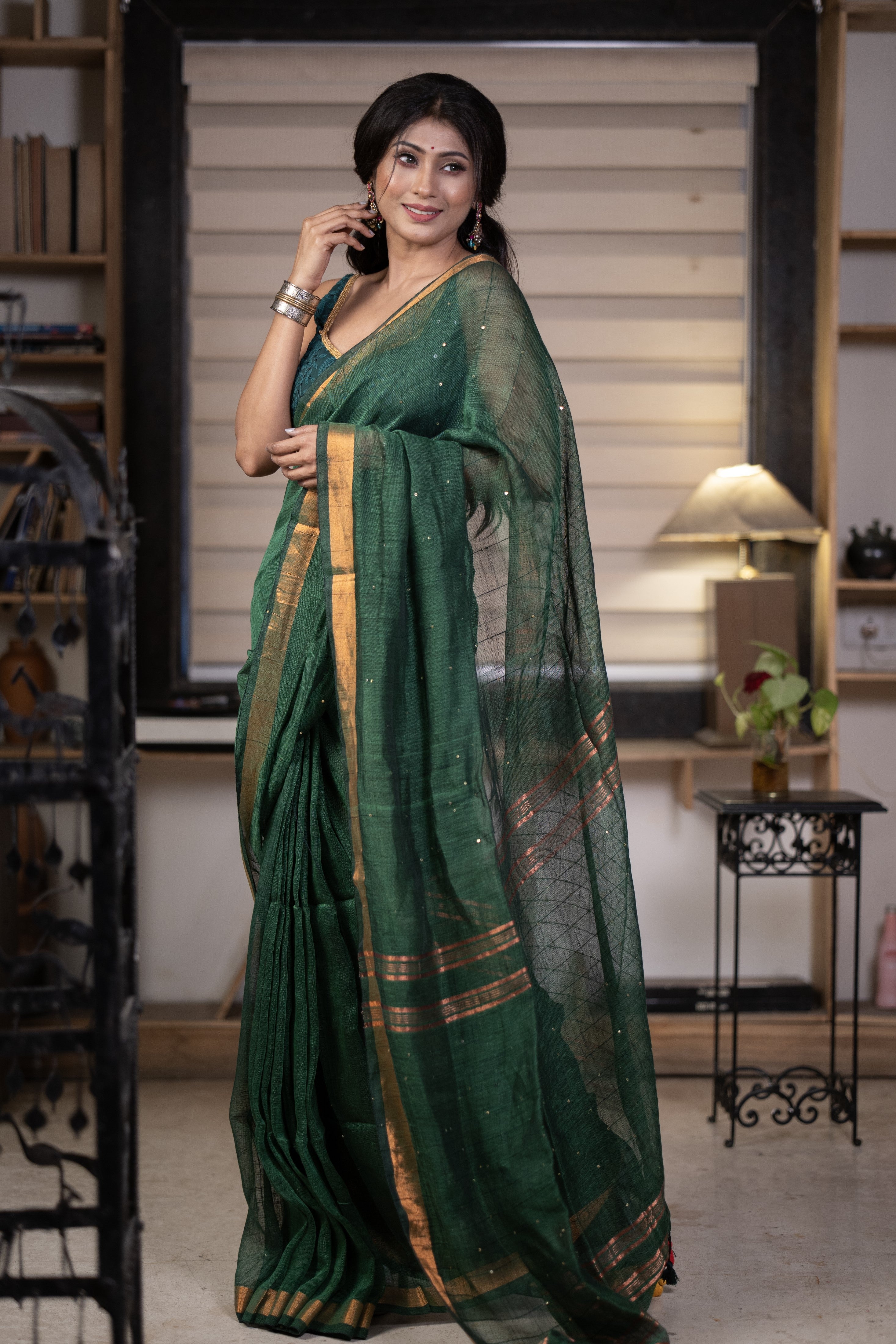 Dark green Sequence Work Linen Saree with golden zari border