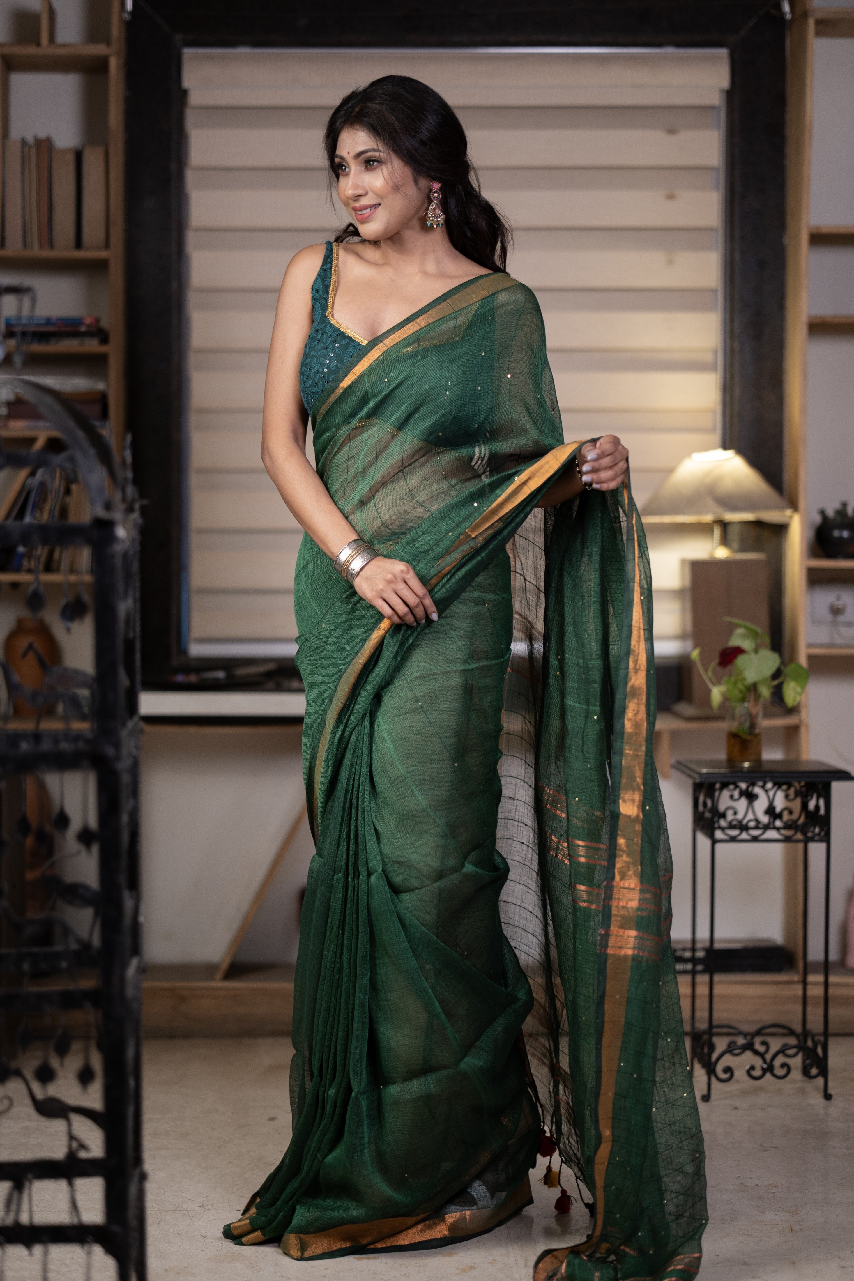 Dark green Sequence Work Linen Saree with golden zari border