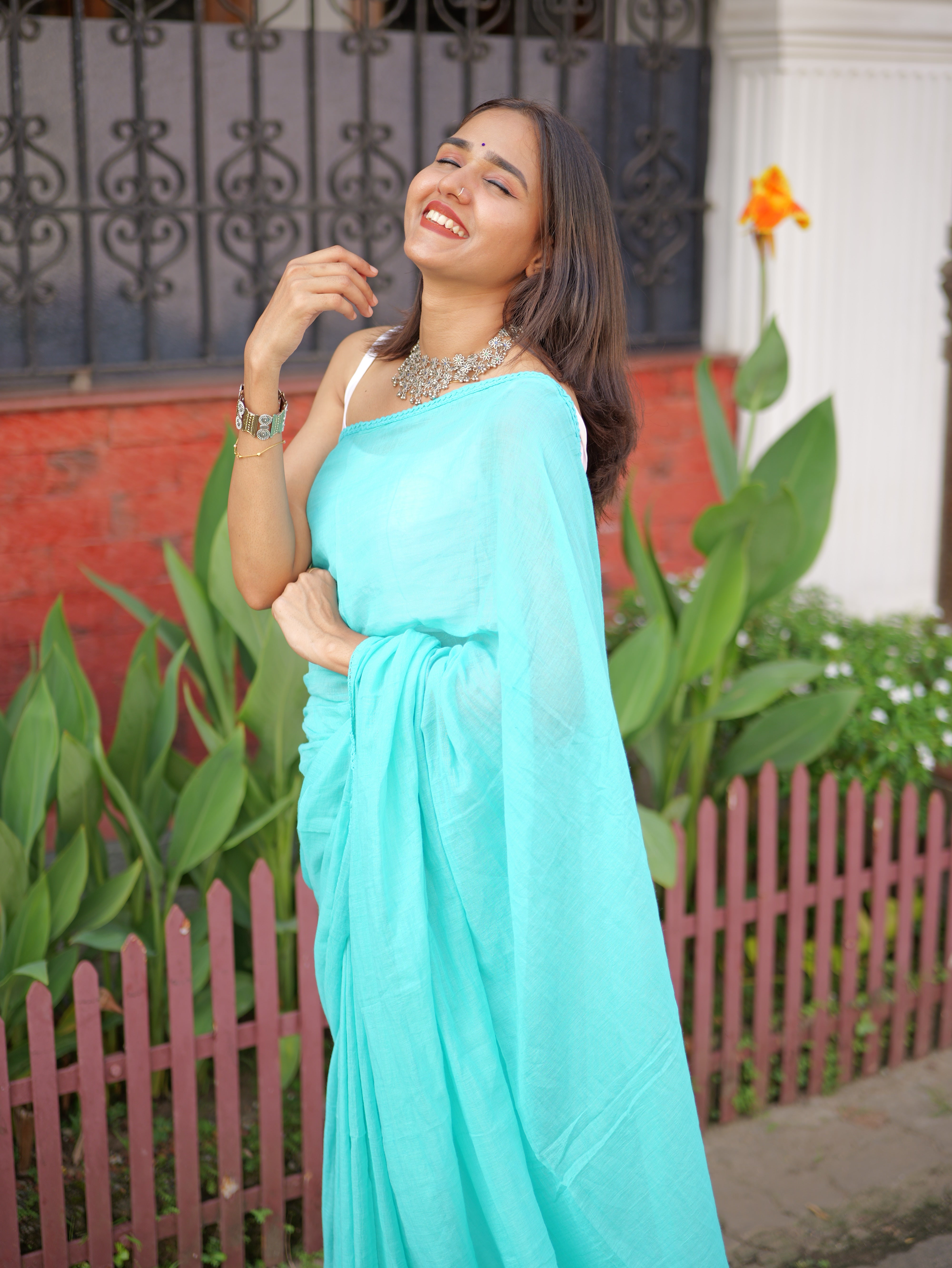 Skyblue mulmul cotton saree with embroidered lace border