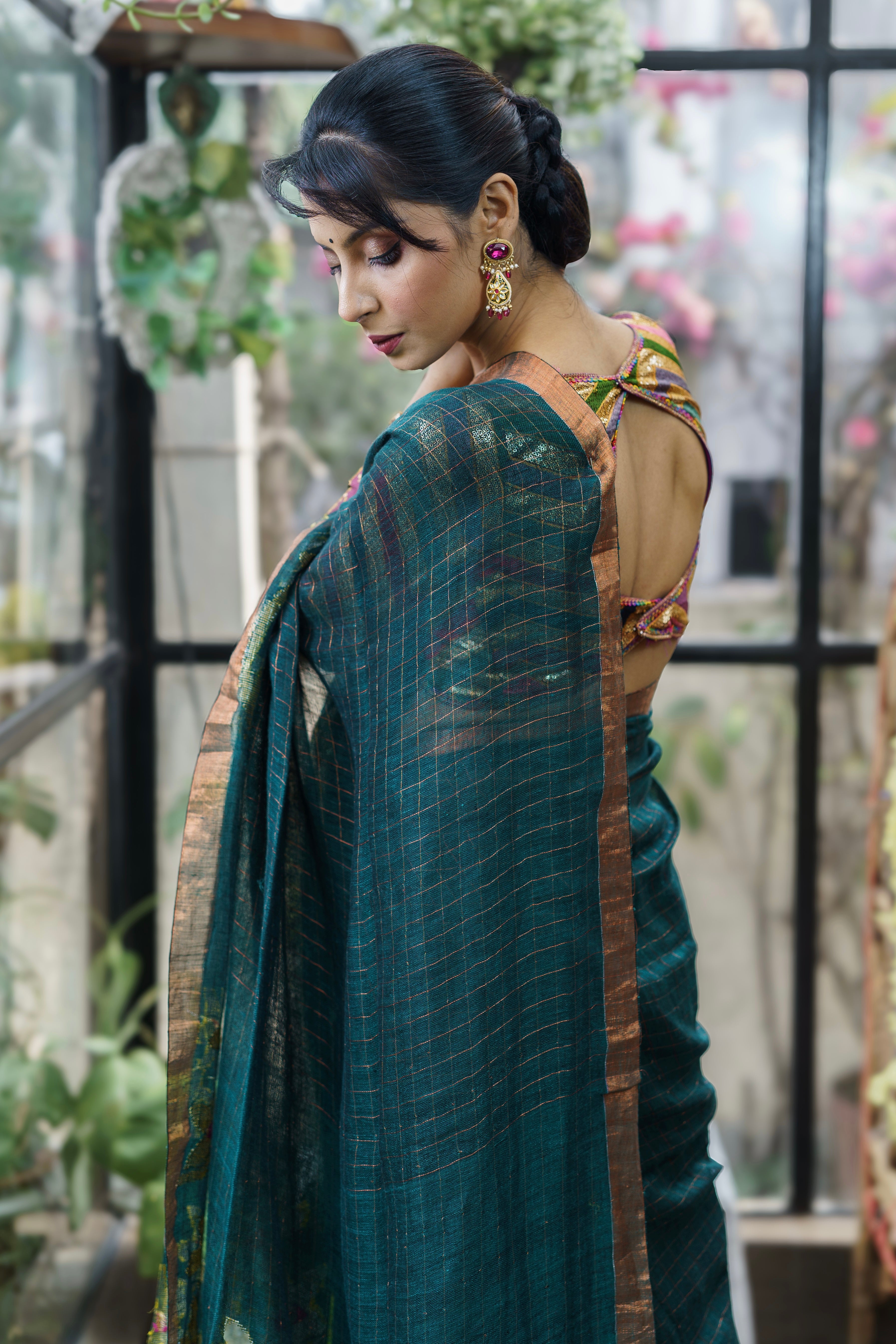 Forest Green Handwoven Linen Saree with Zari Checks & Floral Motifs